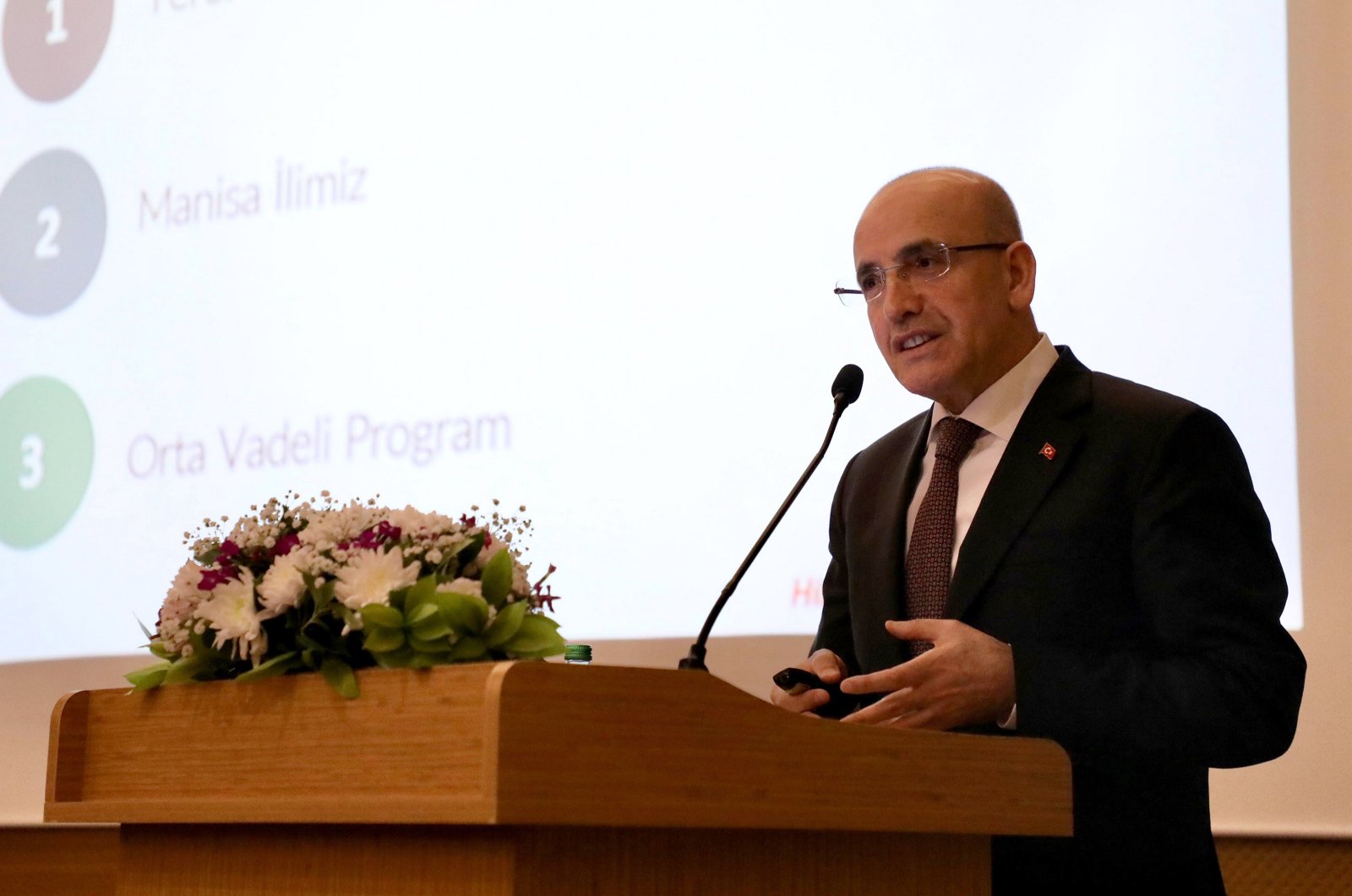 Treasury and Finance Minister Mehmet Şimşek delivers a speech in western Manisa province, Türkiye, Feb. 6, 2024. (AA Photo)