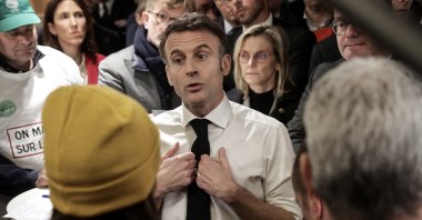 French President Emmanuel Macron (Center) gestures as he speaks with members of the agricultural unions National Federation of Agricultural Holders' Unions (FNSEA), Young Farmers (JA), Rural Coordination (CR) during the opening day of the 60th International Agriculture Fair (Salon de l'Agriculture), in Paris, France, Feb. 24, 2024. (EPA Photo)