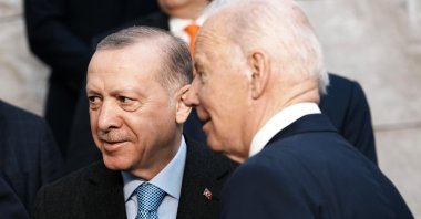 U.S. President Joe Biden speaks with President Recep Tayyip Erdoğan at a group photo during an extraordinary NATO summit at NATO headquarters in Brussels, Belgium, March 24, 2022. (AP Photo)