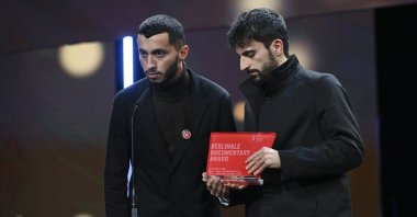 The assistant director of the film &quot;No Other Land,&quot; Basel Adra (L), and the Israeli director of the film, Yuval Abraham, accepted an award for the documentary about the West Bank and called on Germany to stop sending weapons to Israel, Berlin, Germany, Feb. 24, 2024. (AA Photo)