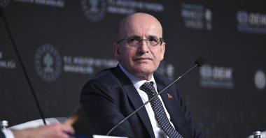 Treasury and Finance Minister Mehmet Şimşek attends a panel as part of the Türkiye-Saudi Arabia Investment and Business Forum, Istanbul, Türkiye, Feb. 16, 2024. (AA Photo)