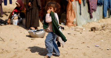 A Palestinian child looks on at a tent camp for displaced people, in Rafah, in the southern Gaza Strip, Palestine, Feb. 26, 2024. (Reuters Photo)