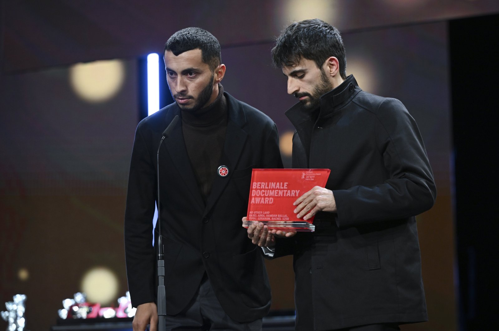 The assistant director of the film &quot;No Other Land,&quot; Basel Adra (L), and the Israeli director of the film, Yuval Abraham, accepted an award for the documentary about the West Bank and called on Germany to stop sending weapons to Israel, Berlin, Germany, Feb. 24, 2024. (AA Photo)