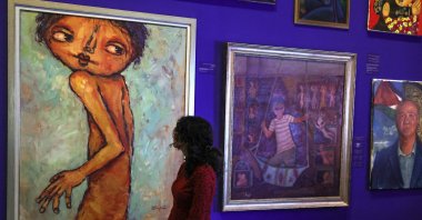 People visit the "This Is Not An Exhibition" section displaying paintings by Gazan artists, as the Palestinian Museum reopened in Birzeit town in the occupied West Bank, Palestine, Feb. 11, 2024. (AFP Photo)