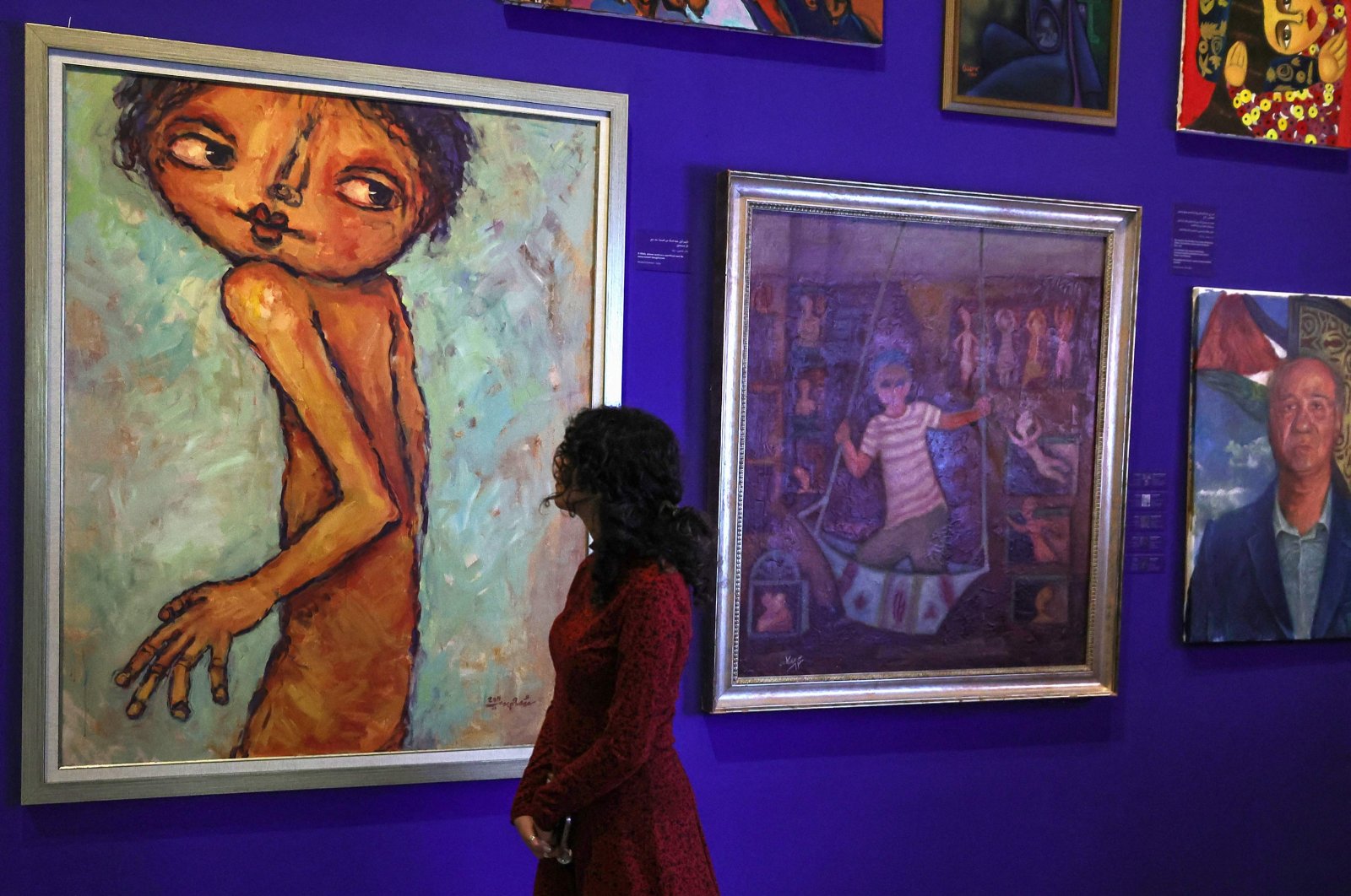 People visit the &quot;This Is Not An Exhibition&quot; section displaying paintings by Gazan artists, as the Palestinian Museum reopened in Birzeit town in the occupied West Bank, Palestine, Feb. 11, 2024. (AFP Photo)