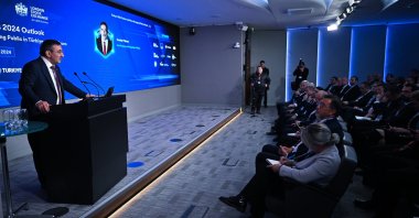 Vice President Cevdet Yılmaz delivers a speech during an investor meeting at the London Stock Exchange, London, U.K., Feb. 27, 2024. (AA Photo)