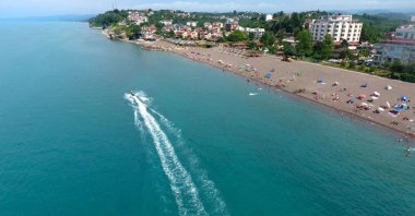 An undated photo of people enjoying sunny day at a beach in Black Sea's coastal city Sinop, Türkiye. (AA Photo)