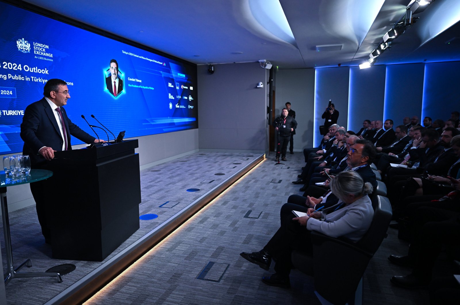 Vice President Cevdet Yılmaz delivers a speech during an investor meeting at the London Stock Exchange, London, U.K., Feb. 27, 2024. (AA Photo)