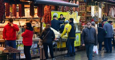 Shoppers walk around delicatessen stores in the Eminönü district in Istanbul, Türkiye, Feb. 28, 2024. (Reuters Photo)