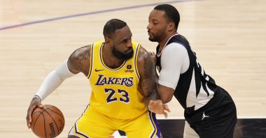 Los Angeles Lakers forward LeBron James (L) dribbles the ball against Los Angeles Clippers guard Norman Powell (R) during the first half of the NBA basketball match, Los Angeles, U.S., Feb. 28, 2024. (EPA Photo)