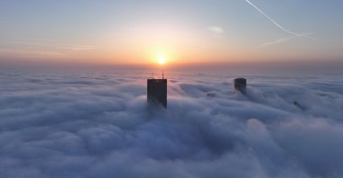 A sea of clouds envelops skyscrapers amid heavy fog in Istanbul, Türkiye, Feb. 29, 2024. (AA Photo)