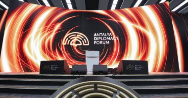 The Antalya Diplomacy Forum logo is displayed on a stage in one of the venues of the event, Antalya, southern Türkiye, Feb. 29, 2024. (AA Photo)