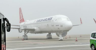 The aircraft of national flag carrier Turkish Airlines (THY) is seen amid dense fog, Istanbul, Türkiye, Feb. 29, 2024. (IHA Photo)