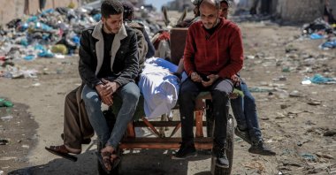 The body of a Palestinian killed in an early morning incident when Israeli forces opened fire on crowds waiting at an aid distribution point in Gaza City, Feb. 29, 2024. (AFP Photo)