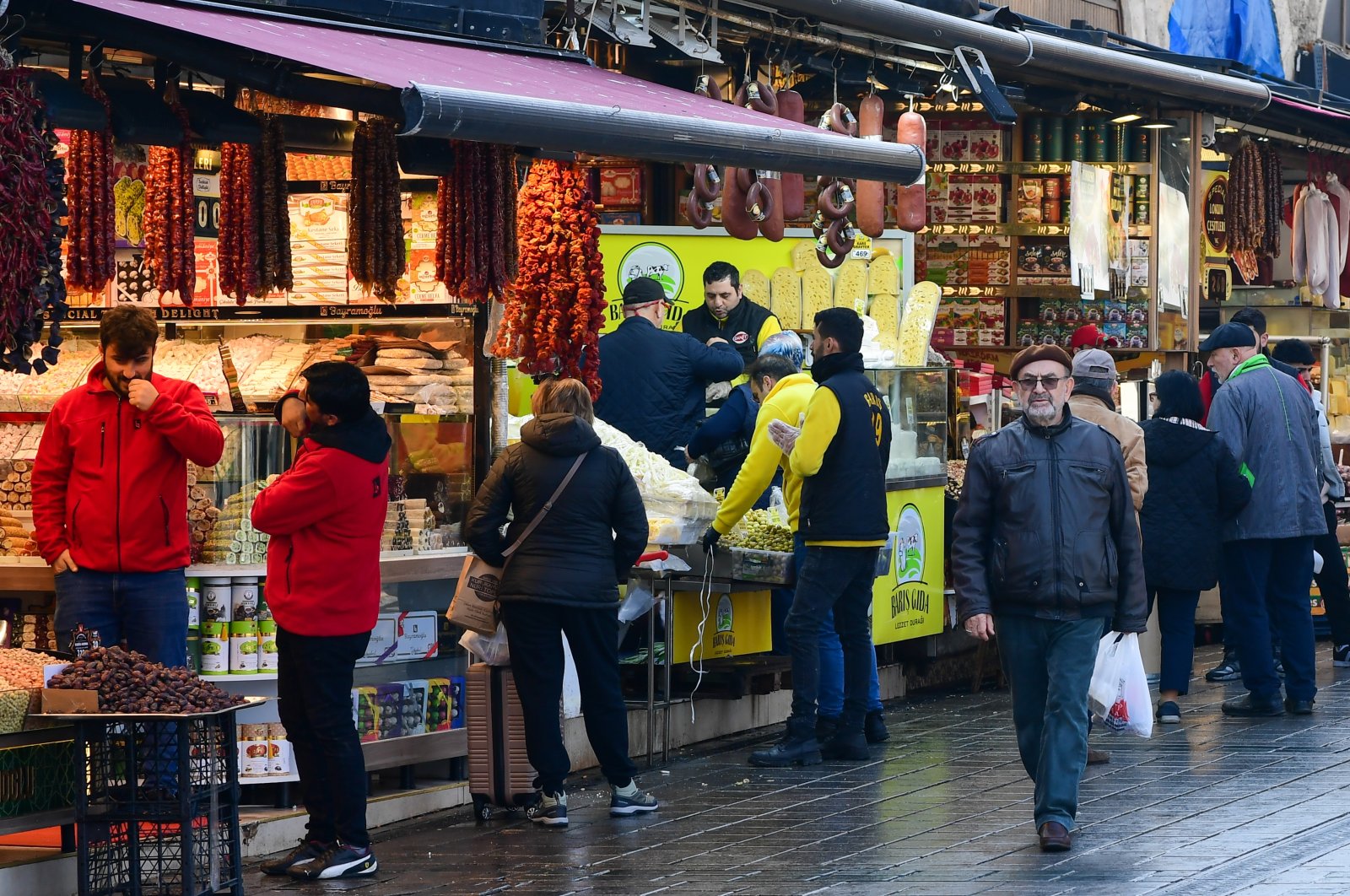 Shoppers walk around delicatessen stores in the Eminönü district in Istanbul, Türkiye, Feb. 28, 2024. (Reuters Photo)