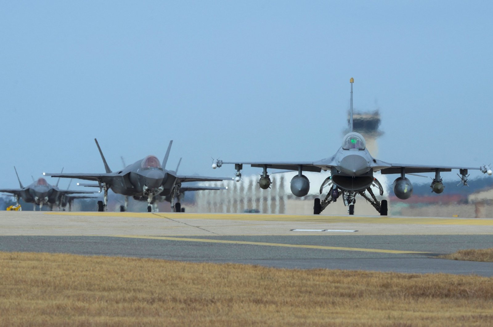U.S. Air Force F-16 Fighting Falcon (R) and F-35A Lightning II fighter jets taxi at Kunsan Air Base in the southwestern port city of Gunsan, South Korea. (U.S. Air Force via AFP)
