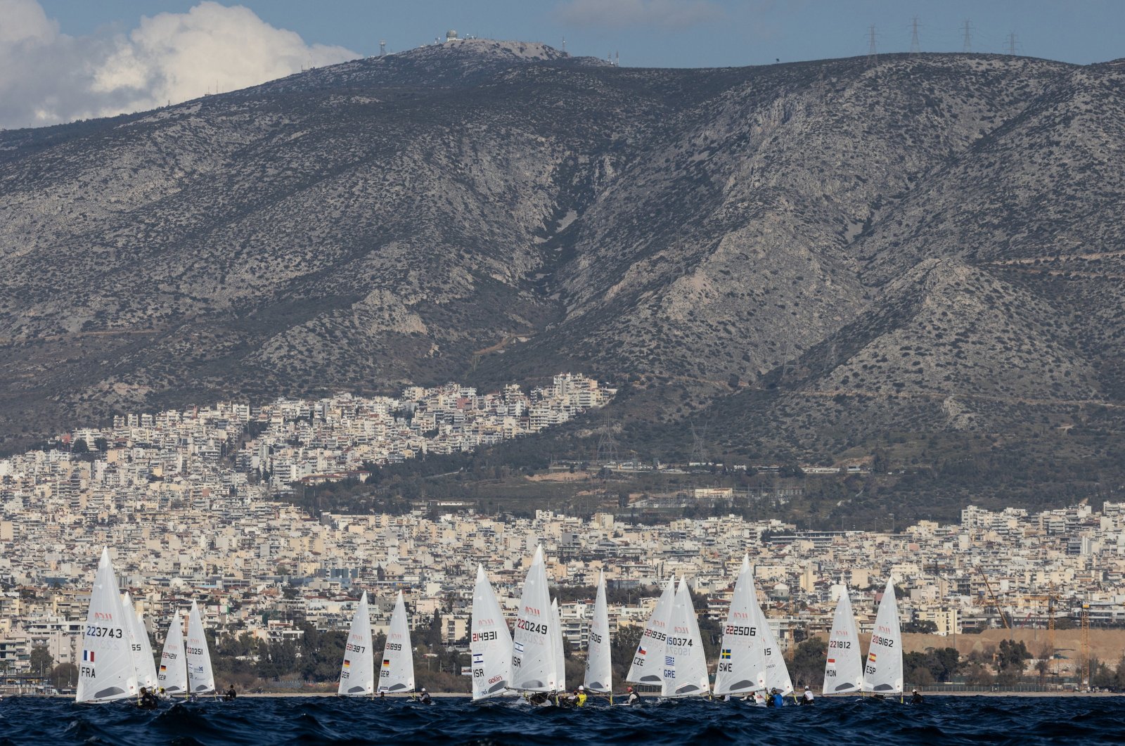 Athletes compete during the last day of the 2024 ILCA Senior Europeans and Open European Trophy Olympic Qualifier for Paris 2024, in the coastal city of Alimos, near Athens, Greece, Feb. 23, 2024.  (EPA Photo)