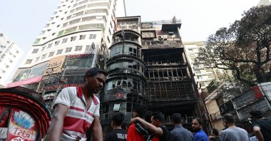 People gather outside the commercial building on Bailey Road, Dhaka, Bangladesh, March 1, 2024. (EPA Photo)