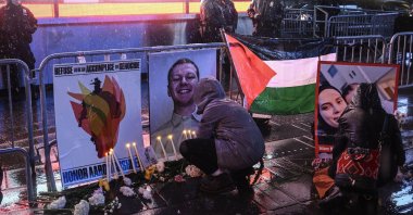 Demonstrators leave flowers for Aaron Bushnell during a vigil at Times Square in New York City, U.S., Feb. 27, 2024. (AA Photo)