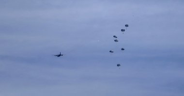 Humanitarian aid is air-dropped by a Jordanian aircraft into the northern Gaza Strip, March 1, 2024. (EPA Photo)