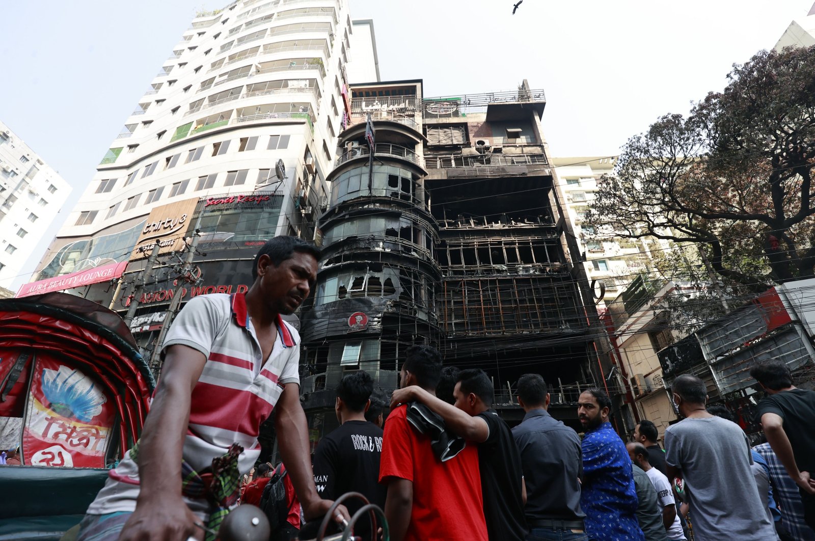 People gather outside the commercial building on Bailey Road, Dhaka, Bangladesh, March 1, 2024. (EPA Photo)