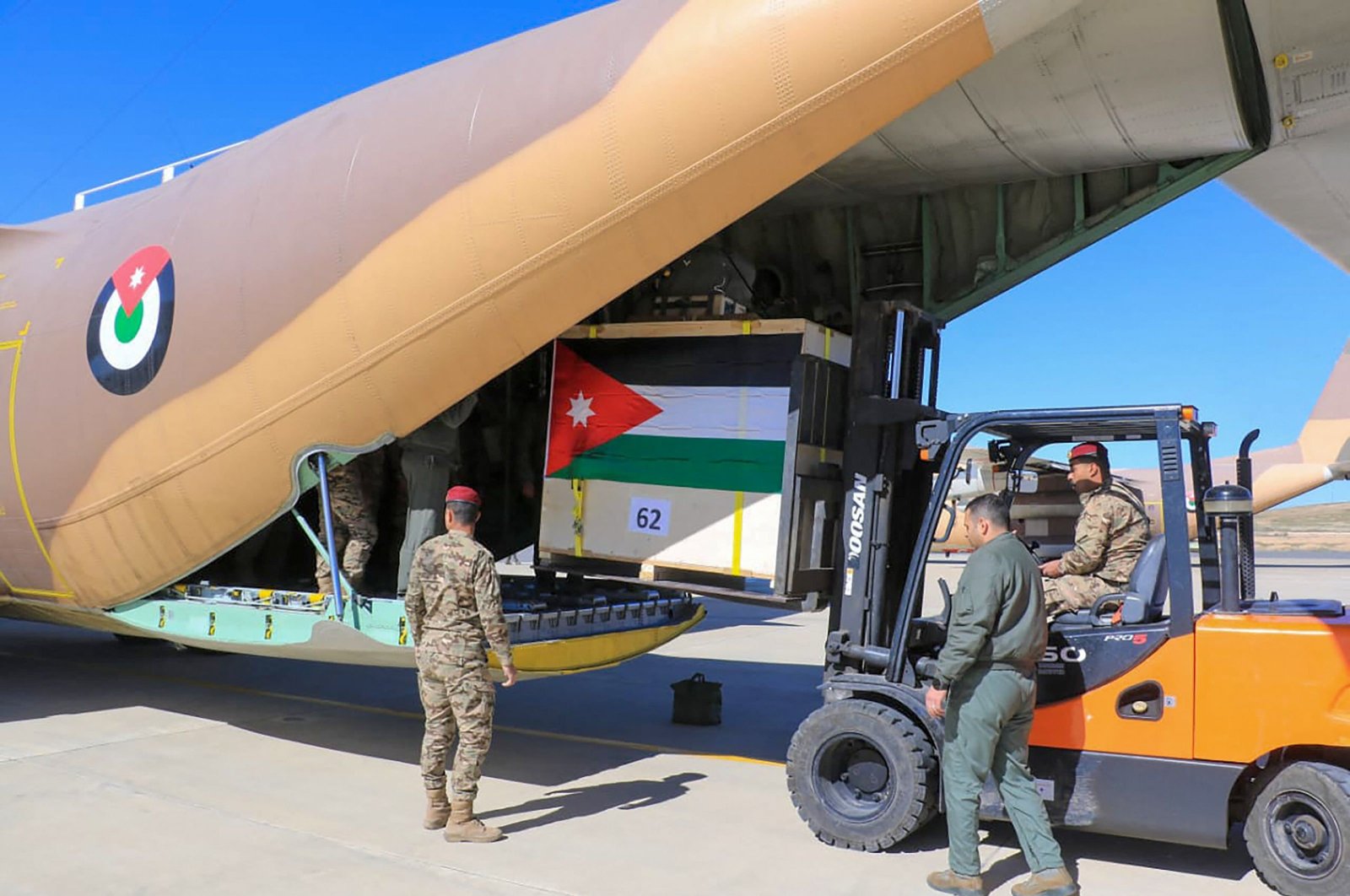 Humanitarian aid destined for the Gaza Strip is being loaded onto a military aircraft at an undisclosed location in Jordan on Feb. 29, 2024. (Jordanian Army Handout via AFP)