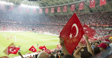 Watching a football game in Türkiye is an immersive cultural experience, where passionate fans rally behind their favorite teams and create a vibrant atmosphere in the stadiums. (Shutterstock Photo) 