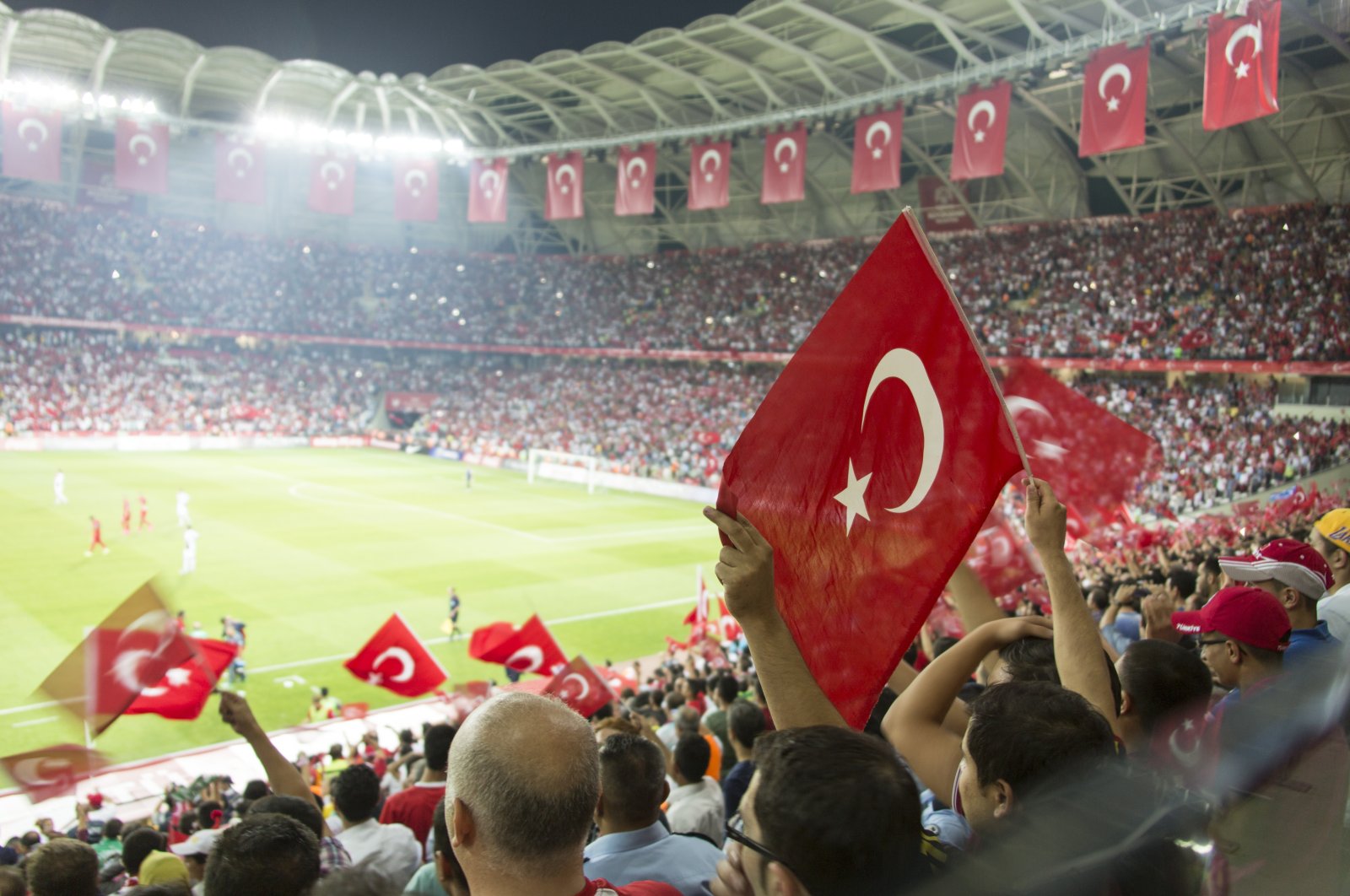 Watching a football game in Türkiye is an immersive cultural experience, where passionate fans rally behind their favorite teams and create a vibrant atmosphere in the stadiums. (Shutterstock Photo) 