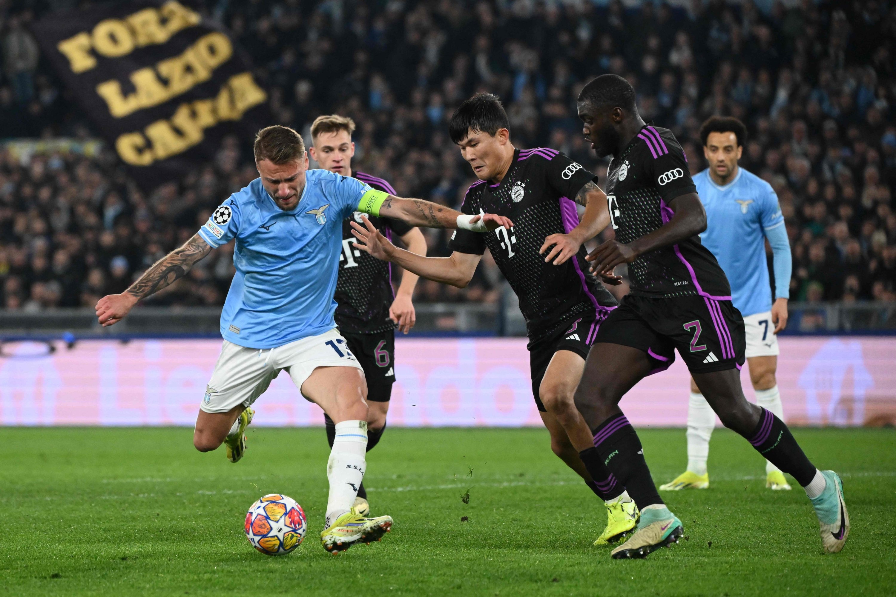 Lazio's Ciro Immobile (L) fights for the ball with Bayern Munich's Dayot Upamecano during the UEFA Champions League last 16 first leg, Olympic stadium, Rome, Italy, Feb. 14, 2024. (AFP Photo)