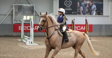 A young Turkish equestrian participates in the launch of the Eyüp Sabri Tuncer 2024 Pony League at the Dila Atlı Sports Club, Istanbul, Türkiye, March 2, 2024. (AA Photo)