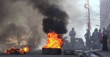 Tires on fire near the main prison of Port-au-Prince, Haiti, March 3, 2024. (AFP Photo)
