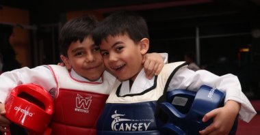 Taekwondo youngsters Muhammet Murat Yıldırım (L) and Miraç Mustafa Önek pose for a photo after training, Erzurum, Türkiye, March 4, 2024. (AA Photo)