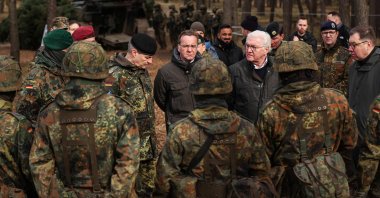 German officials and Ukraine's Ambassador to Germany Oleksii Makeiev react during a visit of Ukrainian troops at the Klietz military training area in Klietz, eastern Germany, Feb. 23, 2024. (AFP Photo)