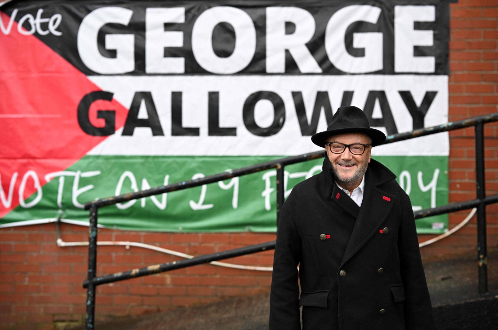 George Galloway, the new Workers Party MP for Rochdale, poses for a photograph outside his campaign headquarters, Rochdale, northern England, March 1, 2024. (AFP Photo)