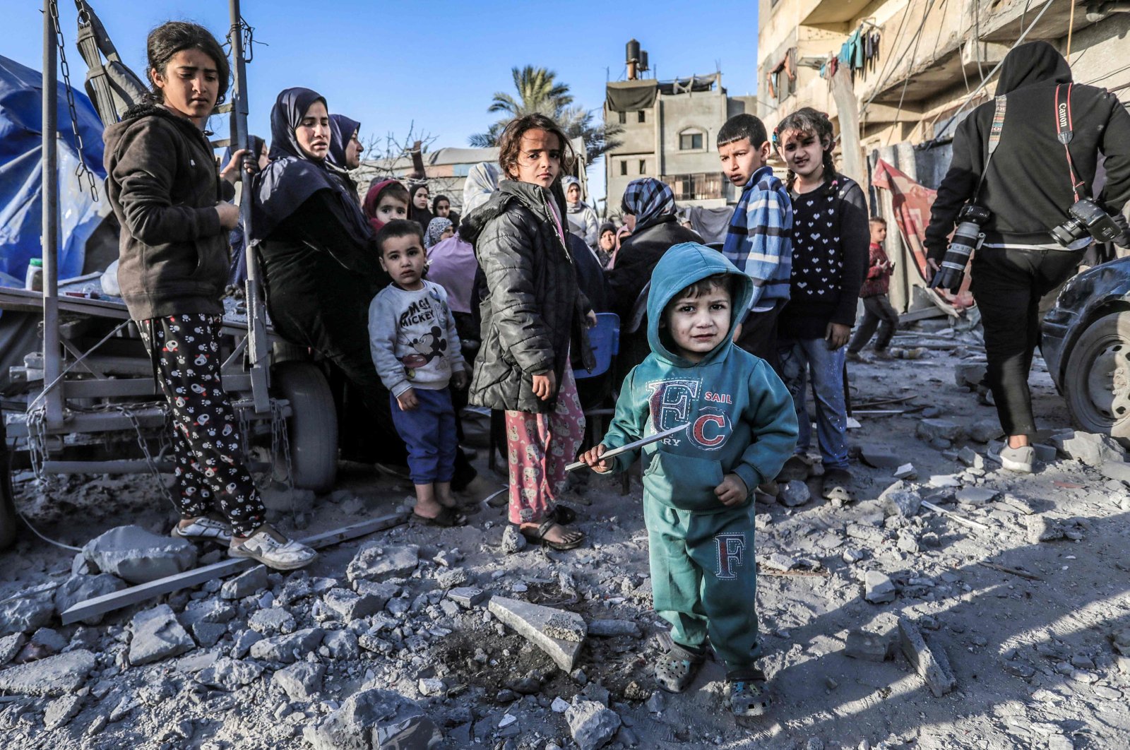 Children stand amid the rubble of a Mosque and makeshift shelters destroyed in Israeli strikes, Deir el-Balah, central Gaza, Palestine, March 2, 2024. (AFP Photo)