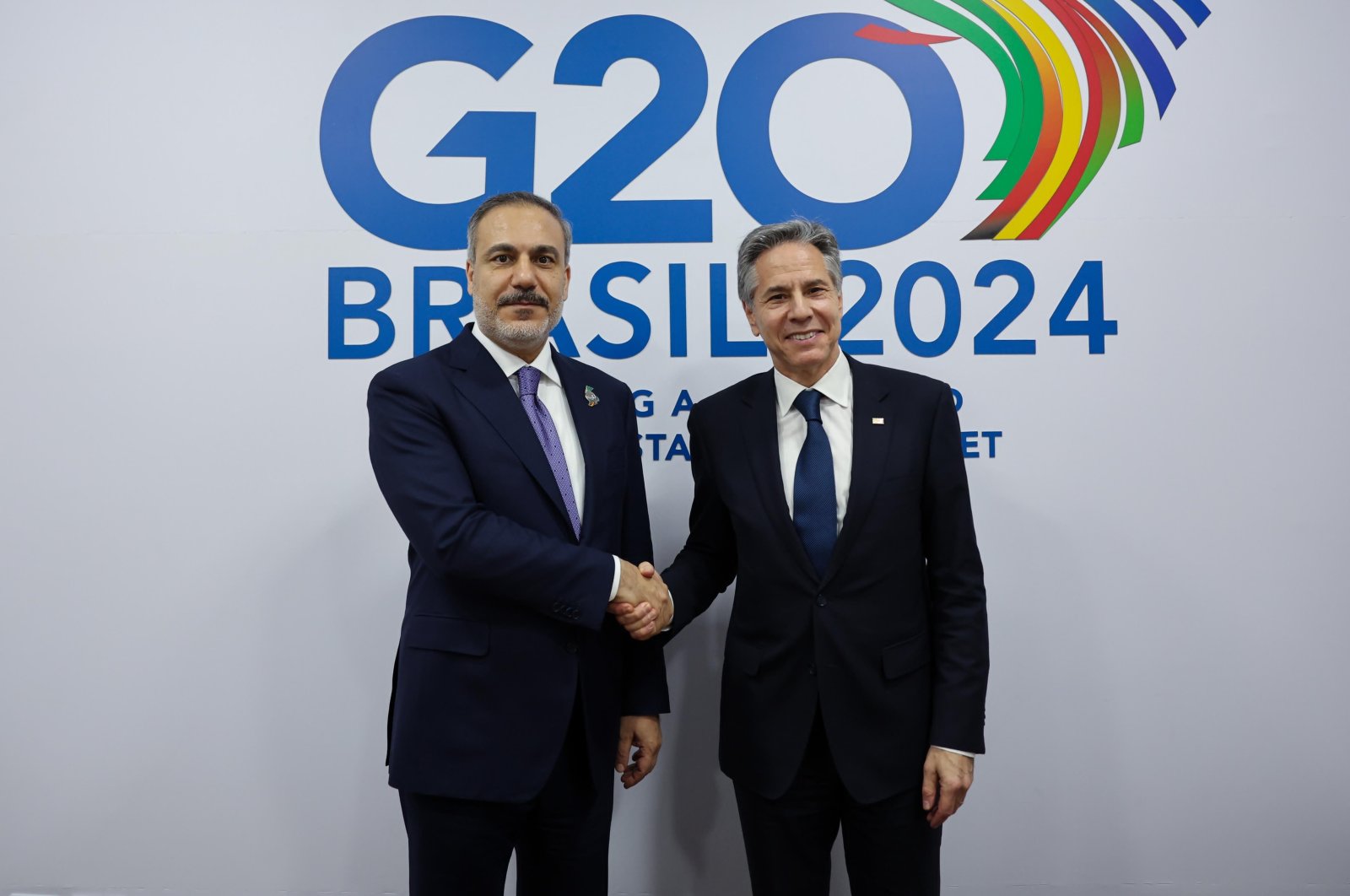 Foreign Minister Hakan Fidan (L) shakes hands with U.S. Secretary of State Antony Blinken on the sidelines of a G-20 summit in Rio de Janeiro, Brazil, Feb. 22, 2024. (DHA Photo)