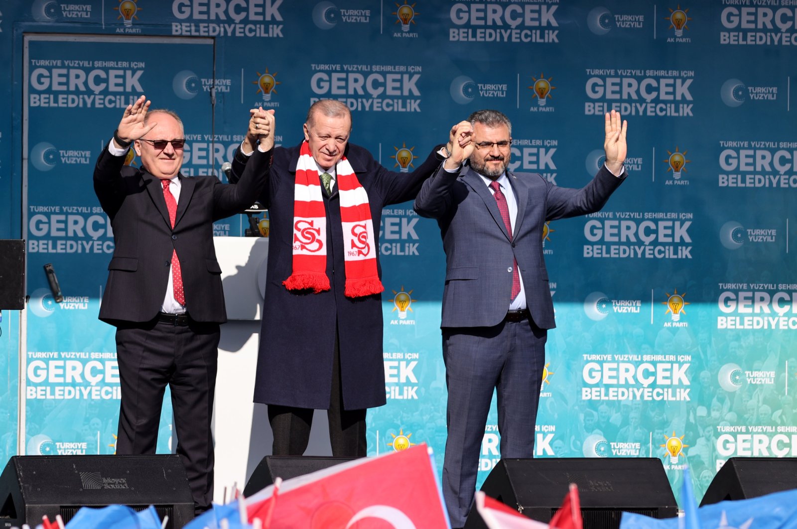 President Recep Tayyip Erdoğan (C) greets the crowd with Sivas Mayor Hilmi Bilgin (L) and AK Party Sivas Chair Yusuf Tanrıverdi (R), Sivas, central Türkiye, March 5, 2024. (AA Photo)
