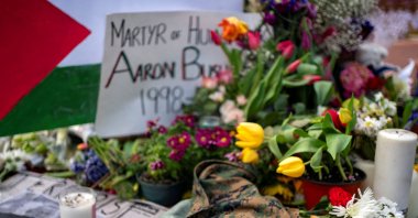 A United States Marines jacket, flowers and candles are placed outside the Israeli Embassy in Washington at a memorial for Aaron Bushnell, an active duty U.S. Air Force member who died after setting himself on fire outside the embassy in an act of protest against the war in Gaza, Washington, U.S., March 2, 2024. (Reuters Photo)