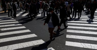 Passersby walk on a street in Tokyo, Japan Feb. 15, 2024. (Reuters File Photo)