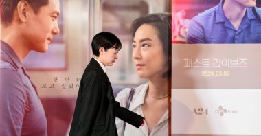 South Korean-Canadian director, playwright and screenwriter Celine Song walks on the stage to pose for photos after a screening of her film "Past Lives" in Seoul, South Korea, Feb. 28, 2024. (AFP Photo)