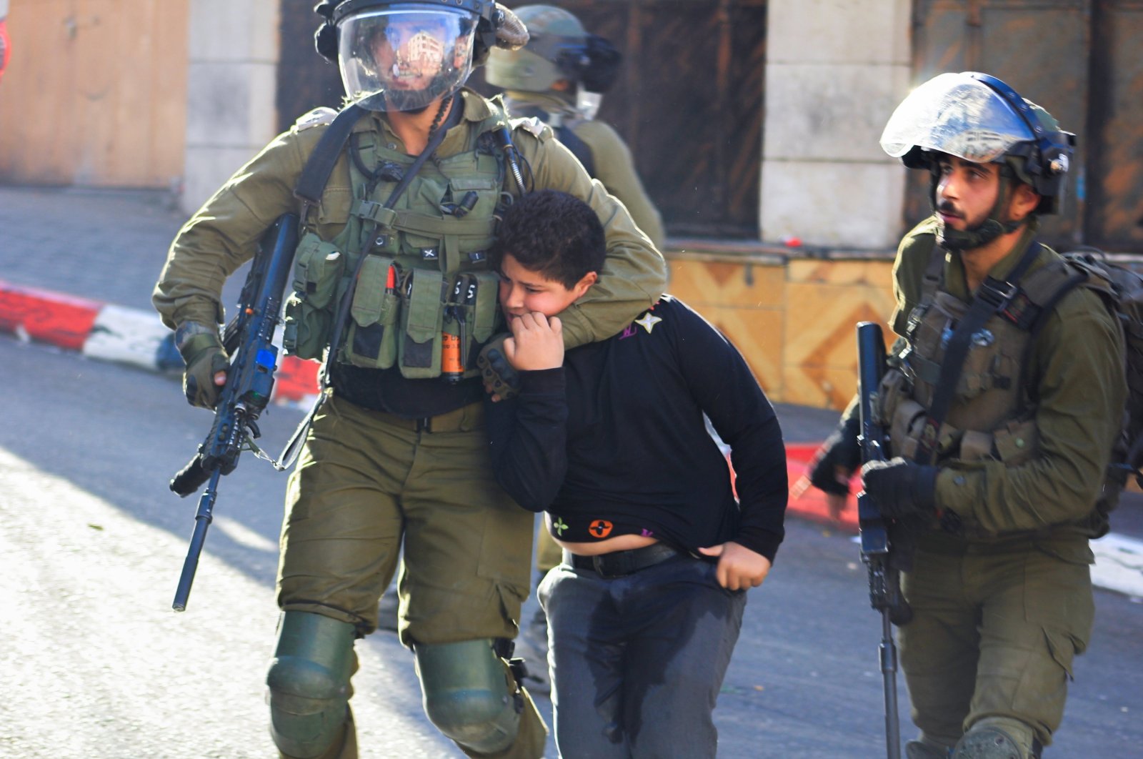 Israeli soldiers detain a Palestinian child, Hebron, Israeli-occupied West Bank, Palestine, Sept. 23, 2021. (Reuters File Photo)