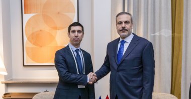 Moldova's Foreign Minister Mihai Popsoi (L) shakes hands with Foreign Minister Hakan Fidan during a meeting in Munich, Germany, Feb. 16, 2024. (AA Photo)