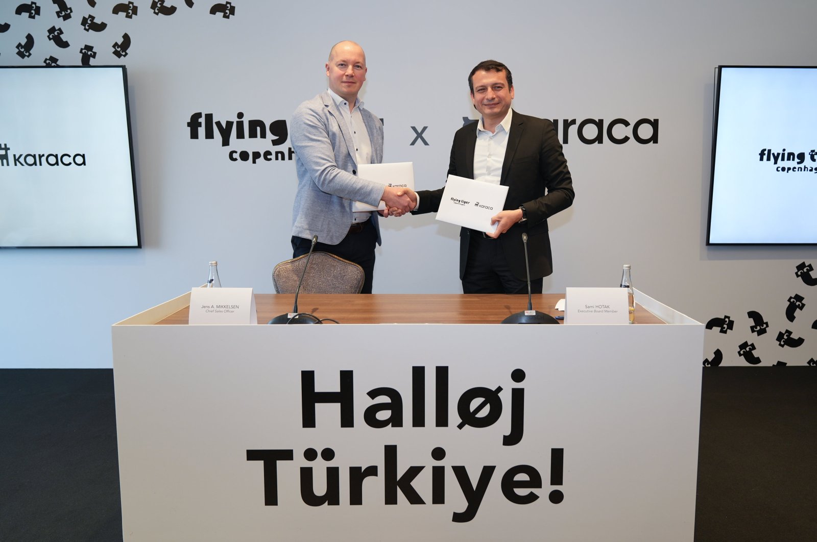 Chief sales officer of the Flying Tiger Copenhagen Jens Aarup Mikkelsen (L) and Sami Hotak, Karaca Group board member shake hands during the presentation of partnership, Istanbul, Türkiye, March 5, 2024. (AA Photo)