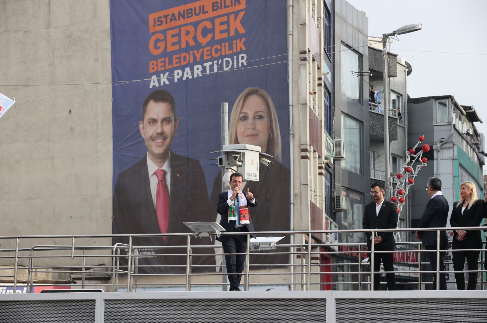 Istanbul Mayor Ekrem Imamoğlu speaks at an event, against the backdrop of an election poster of Justice and Development Party (AK Party) candidates, Istanbul, Türkiye, Feb. 28, 2024. (AA Photo)