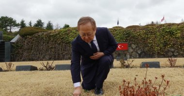 CEO of MegeGen Implant firm, which is set to invest in Türkiye, Kwang Bum Park lays down flowers at the cemetery of Turkish soldiers, Busan, South Korea, Feb. 20, 2024. (AA Photo)