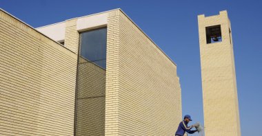 A construction worker performs his role in the final works to establish the Ibrahim Al-Khalil Church, which is the first church built to attract tourists and Christian visitors to the ancient city, Ur, Iraq, Feb. 22, 2024. (Reuters Photo)