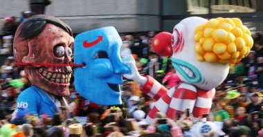 A carnival float depicting a clown lifting a German far-right AfD party mask from the face of Adolf Hitler seen in Duesseldorf, Germany, Feb. 12, 2024. (EPA Photo)