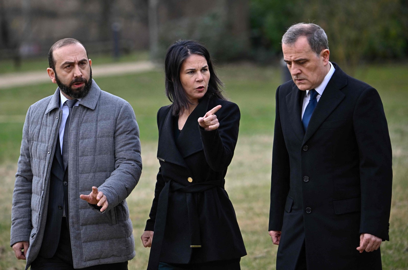 German Foreign Minister Annalena Baerbock (C) walks with Armenia&#039;s Foreign Minister Ararat Mirzoyan (L) and Azerbaijan&#039;s Foreign Minister Jeyhun Bayramov (R) during peace talks at Villa Borsig, the guesthouse of the German Foreign Ministry, Berlin, Germany, Feb. 28, 2024. (AFP Photo)