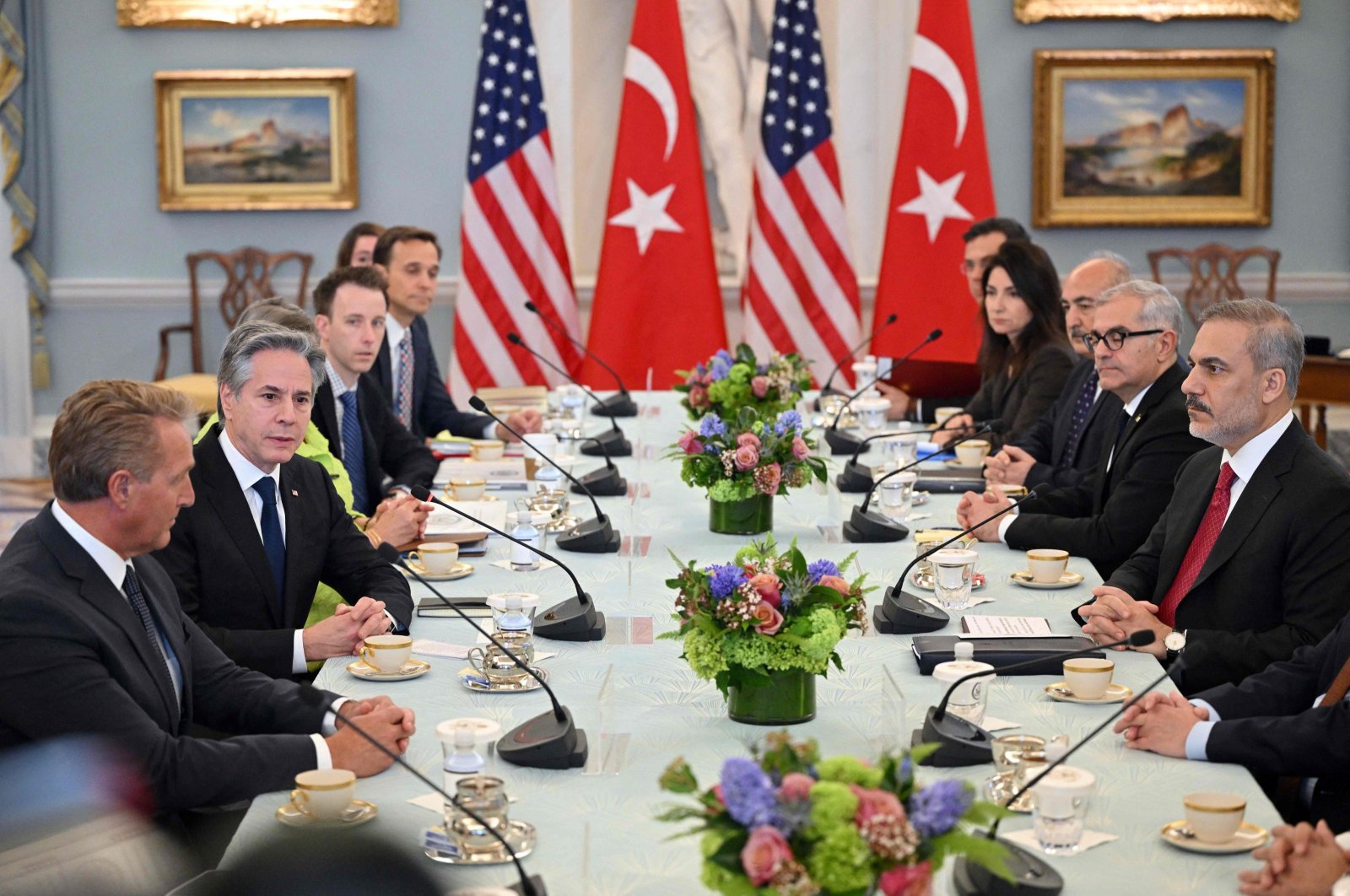 U.S. Secretary of State Antony Blinken (2nd L), with U.S. Ambassador to Türkiye, Jeff Flake (L), takes part in a meeting with Türkiye’s Foreign Minister Hakan Fidan (R), in Washington, D.C., March 8, 2024. (AFP Photo)