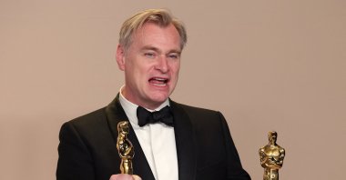 Christopher Nolan poses with the Oscar for Best Picture and Best Director Oscar for &quot;Oppenheimer,&quot; in the Oscars photo room at the 96th Academy Awards in Hollywood, Los Angeles, California, U.S., March 10, 2024. (Reuters Photo)